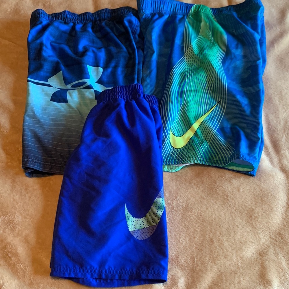 Nike and UA swim trunks